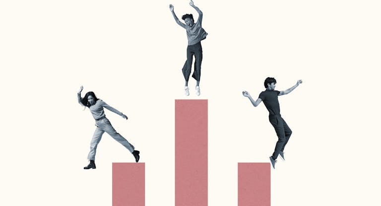 Cheerful multi-ethnic friends jumping on pink columns