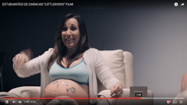 A mother gets excited about her preborn baby's first soccer game in this screen shot.