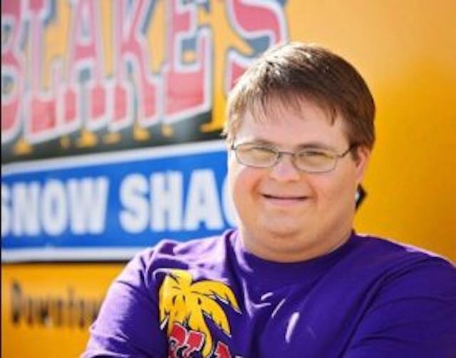 Blake in front of his Snow Shack image from his Facebook page Blake at hos Snow Shack image from his Facebook page