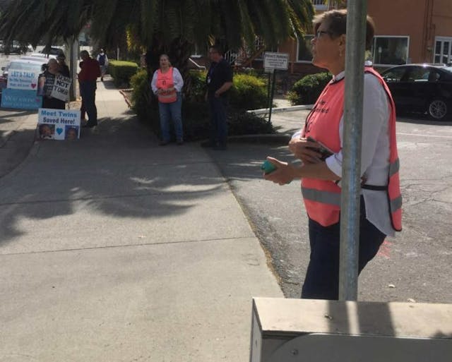 Facility escorts stand in driveway at Walnut Creek PP Pro-lifers claim accusations prompting local California buffer zone ordinance are false image