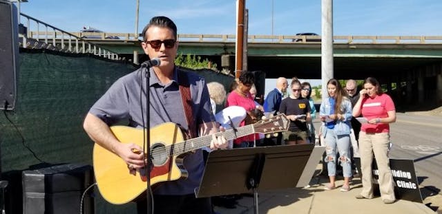 Matt Brumfield of Bound4Life leads worship at the pro-life protest of the new Planned Parenthood in Birmingham, AL. Photo courtesy of Natalie Brumfield