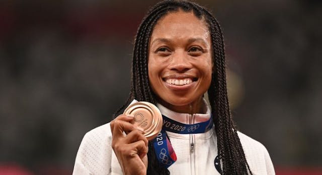Bronze medallist USA’s Allyson Felix celebrates on the podium… August 6, 2021. (Photo by Ina FASSBENDER / AFP) (Photo by INA FASSBENDER/AFP via Getty Images) Bronze medallist USA’s Allyson Felix celebrates on the podium… August 6, 2021. (Photo by Ina FASSBENDER / AFP) (Photo by INA FASSBENDER/AFP via Getty Images)