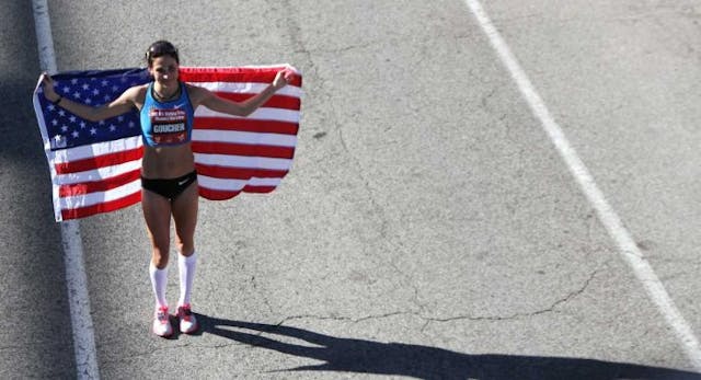 HOUSTON, TX – JANUARY 14: Kara Goucher… holds an American flag after the U.S. Marathon Olympic Trials January 14, 2012 in Houston, Texas. (Photo by Thomas B. Shea/Getty Images) HOUSTON, TX – JANUARY 14: Kara Goucher… holds an American flag after the U.S. Marathon Olympic Trials January 14, 2012 in Houston, Texas. (Photo by Thomas B. Shea/Getty Images)