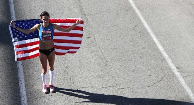 HOUSTON, TX – JANUARY 14: Kara Goucher… holds an American flag after the U.S. Marathon Olympic Trials January 14, 2012 in Houston, Texas. (Photo by Thomas B. Shea/Getty Images)