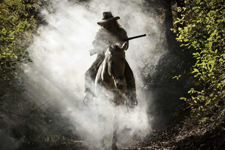 Silhouette of the rider on the horse