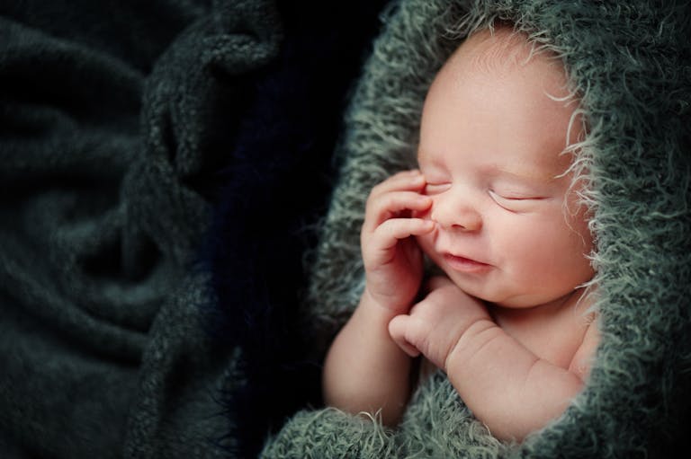 green-blanket-baby