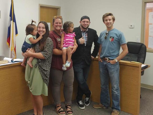 Sundown Residents Aerin Strickland, Amber Scarlett, and Matthew Nichols take a picture with Mark Lee Dickson after the historic vote. (Photo: Mark Lee Dickson)