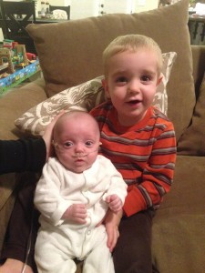 Naomi at home with big brother Nathaniel.