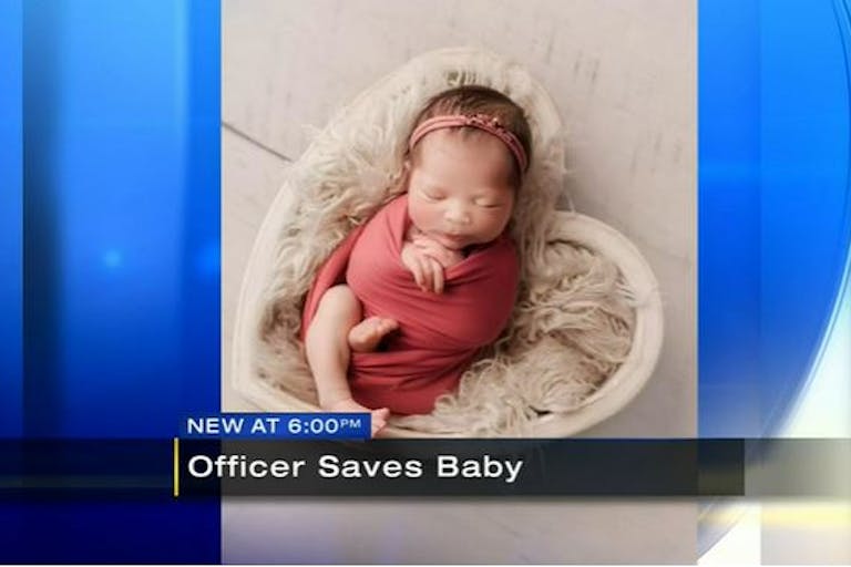 screenshot, officer saves baby