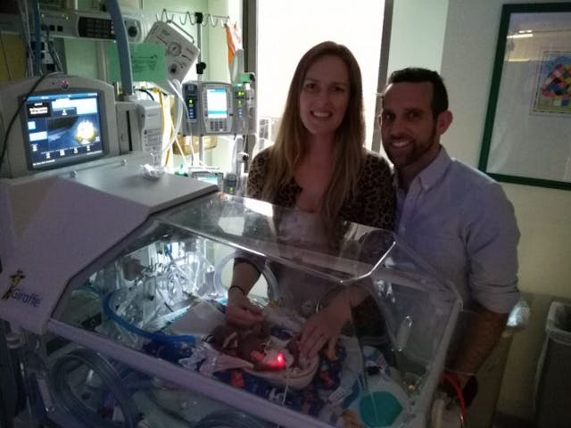 Tim and Megan Artman with Benson. facebook