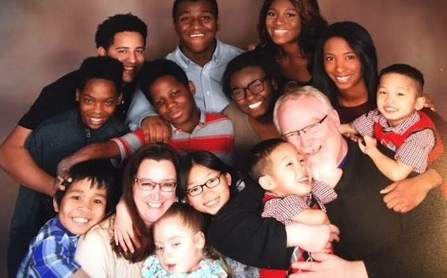An older photo of the McKinney family (some family members not pictured) ‘Always room for more’: Adopting 13 children has made life one giant adventure image