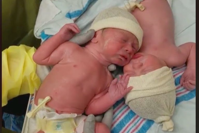 Twins comfort, Caleb and Weston