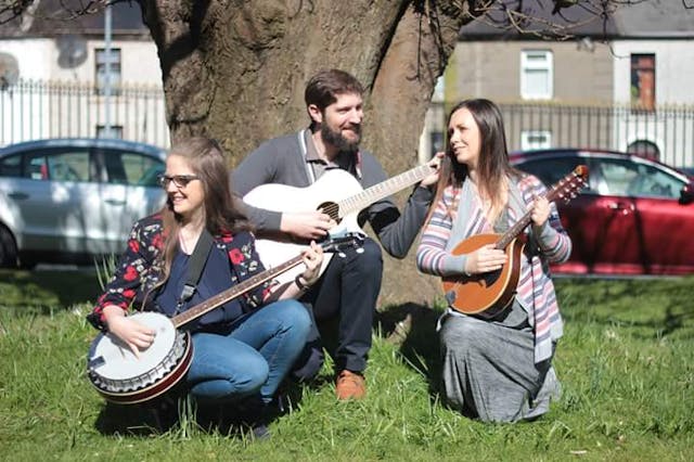 The Mustard Seeds: left to right, Carla Maria Corless (vocals, piano, banjo), Neil Foley (vocals, guitar), Katie Black (vocals, mandolin, tin whistle). The band name is derived from Matthew 17:20. pro-life band