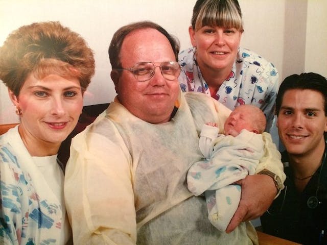 Rocky holds baby Morgan with the hospital staff after he found her as a newborn in the dumpster. Photo courtesy of Morgan Hill. No one knew Morgan's mother was pregnant.