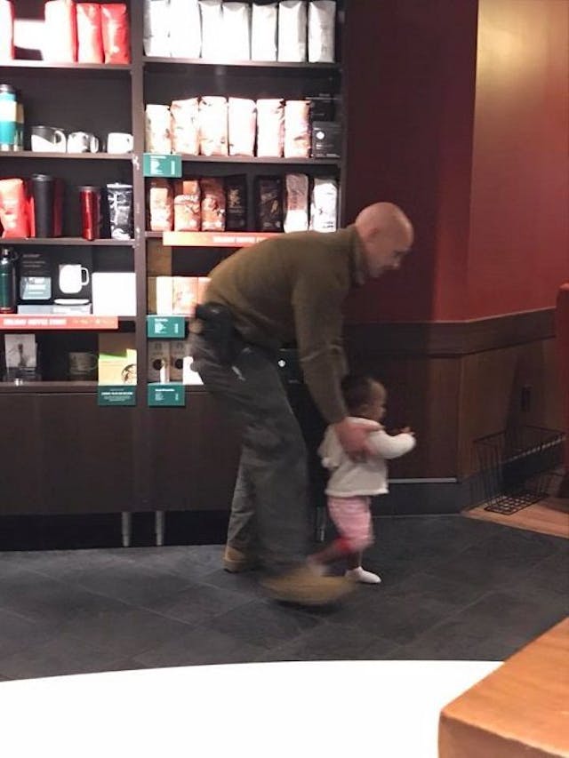 State troopers played with a Starbucks employee’s daughter after her childcare fell through. Photo via Facebook. Helping women