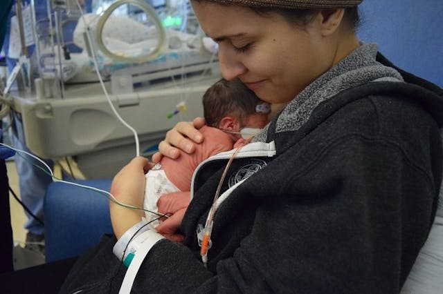 Baby Petra being held by her mother after her premature birth. Photo courtesy of Staycie Kirkendall. Petra was a premature baby.