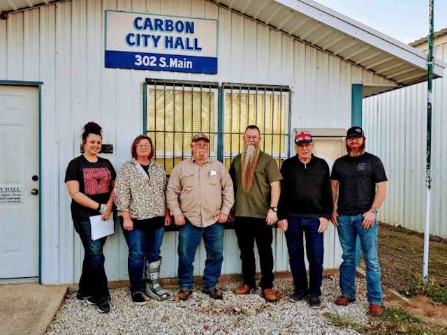 Pictured: Mayor Corey Hull, the Carbon City Council, and the City Secretary. (Photo by Mark Lee Dickson)