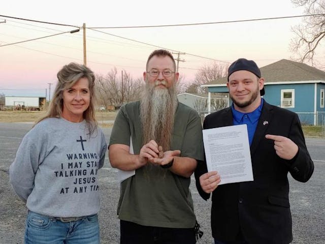 Eastland County Republican Party Chair Robin Hayes, Carbon Mayor Corey Hull, and Director with Right To Life of East Texas and Founder of the Sanctuary Cities for the Unborn Initiative Mark Lee Dickson pose with a picture of a 12 week fetal model. (Photo: Mark Lee Dickson)