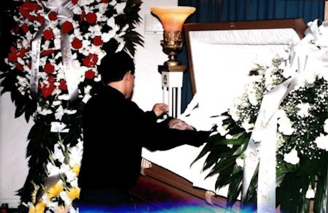 Husband of woman killed from legal abortion over her casket.