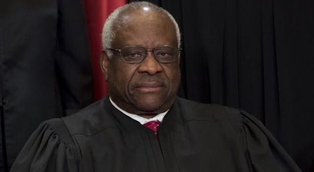 US Supreme Court Associate Justice Clarence Thomas sits for an official photo… in Washington, DC, June 1, 2017. (SAUL LOEB/AFP via Getty Images) Clarence Thomas, Planned Parenthood, eugenics