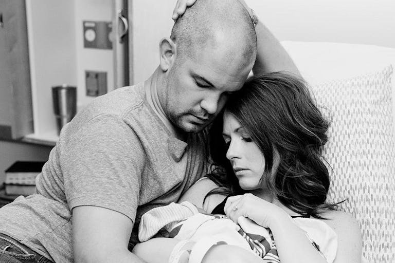 The couple holds baby Grace shortly after her birth. They chose life for their daughter. Photo by Kayla Gonzales of An Infinite Moment Photography.