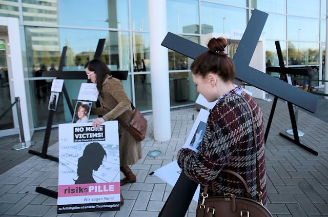 Women carry crucifixes with photos of women who died after taking contraceptives produced by Bayer as they protest in front of the venue of the annual general meeting of German chemicals and pharmaceuticals giant Bayer on April 29, 2016 in Cologne, western Germany. Different contraceptive pills of the company are suspected of causing thrombosis and embolisms.  (Photo credit: OLIVER BERG/DPA/AFP via Getty Images) Women carry crucifixes with photos of women who died after taking contraceptives produced by Bayer as they protest in front of the venue of the annual general meeting of German chemicals and pharmaceuticals giant Bayer on April 29, 2016 in Cologne, western Germany. Different contraceptive pills of the company are suspected of causing thrombosis and embolisms.  (Photo credit: OLIVER BERG/DPA/AFP via Getty Images)