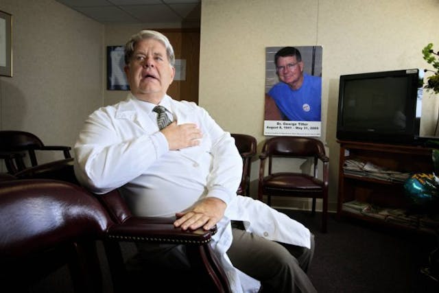 Dr. LeRoy H. Carhart sits next to a photograph of his murdered colleague and friend, Dr. Tiller. Carhard’s clinic, the Women’s Health Clinic, which provides abortions and contraceptives, is a frequent target for the Operation Rescue, who are vehemently protesting any abortion. (Photo by Orjan F. Ellingvag/Dagens Naringsliv/Corbis via Getty Images) Late-term abortionist LeRoy Carhart dead at 81 image