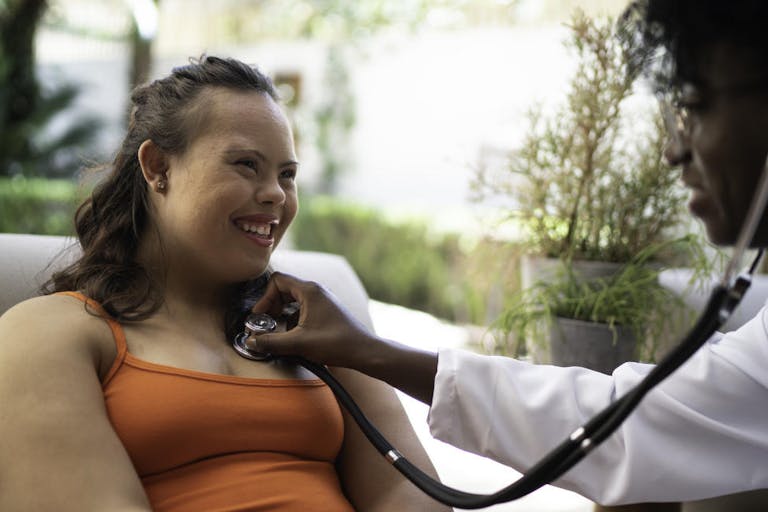 Special needs woman being examining