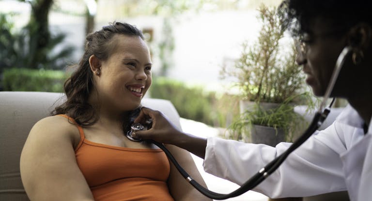 Special needs woman being examining