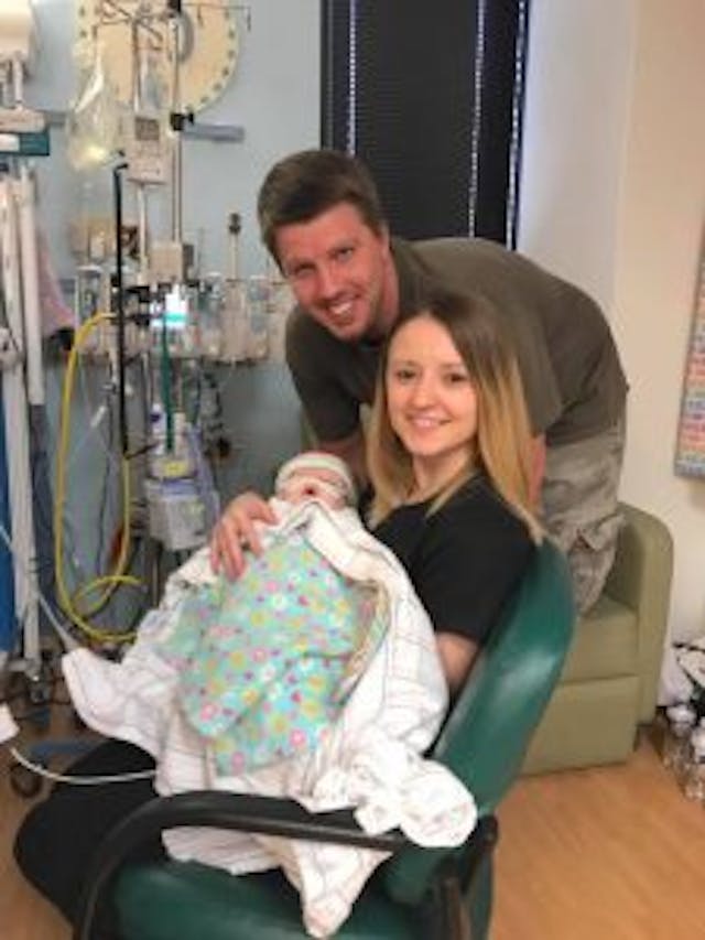Brian and Sierra Hunt happy to be holding baby Christa again after 16 days. photo via Facebook