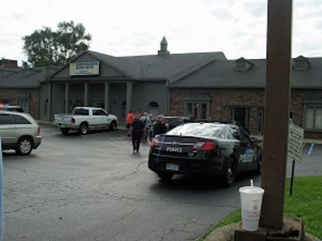 Police arrive for Bob Adis