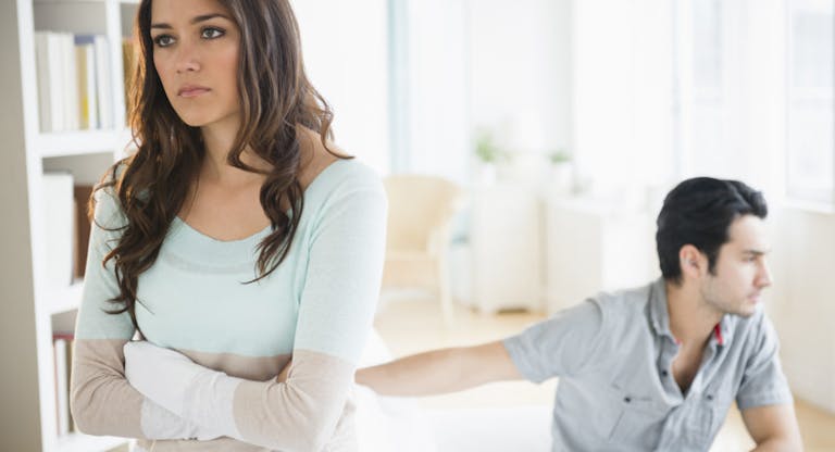 Couple arguing in living room