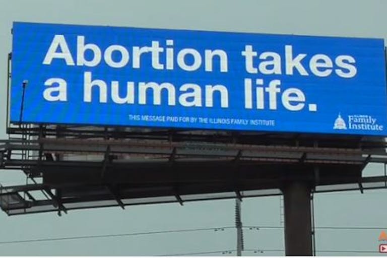 screenshot from video, billboard, abortion
