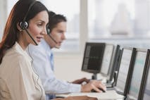 Hispanic businesswoman working on computer