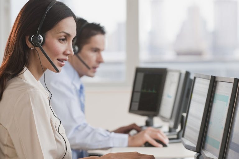 Hispanic businesswoman working on computer