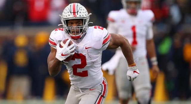 ANN ARBOR, MICHIGAN – NOVEMBER 30: J.K. Dobbins #2 of the Ohio State Buckeyes runs for a fourth quarter touchdown while playing the Michigan Wolverines at Michigan Stadium on November 30, 2019 in Ann Arbor, Michigan. Ohio State won the game 56-27. (Photo by Gregory Shamus/Getty Images) J.K. Dobbins