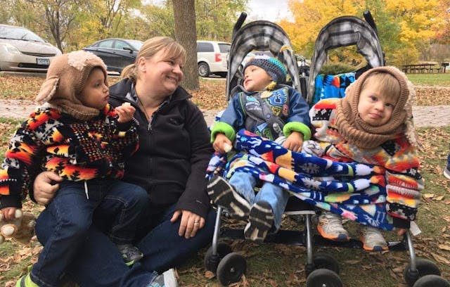 Parents of baby with Down syndrome adopt twins born with special needs image