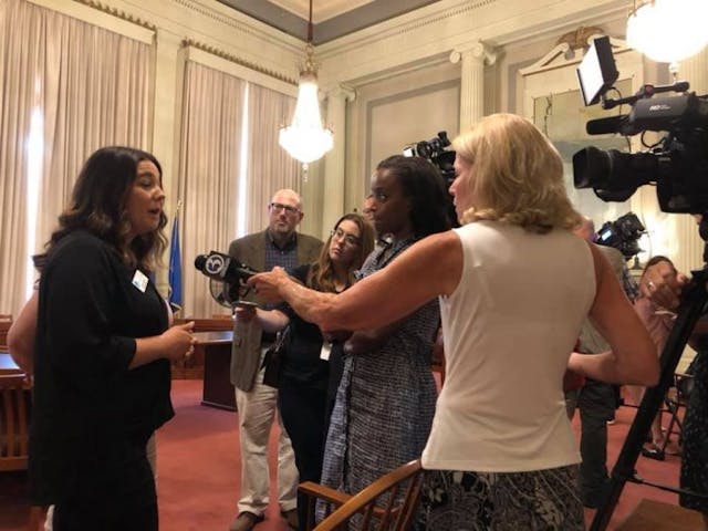 Molly Hurtado, executive director of ABC Women’s Center talks to reports in Hartford. Photo courtesy of Christina Bennett.