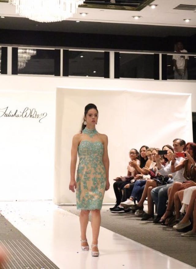 Marian Avila walks the runway for Talisha White at New York Fashion Week. Photo via Facebook. Model with Down syndrome