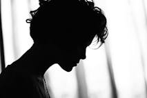 silhouette of a sad woman