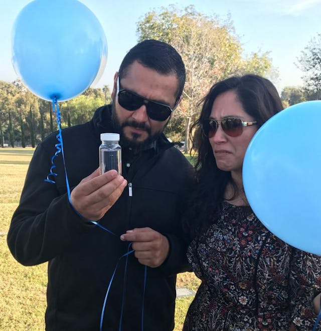 Joshua Jair’s godparents say goodbye (Photo: Claudia Zaragosa) miscarried