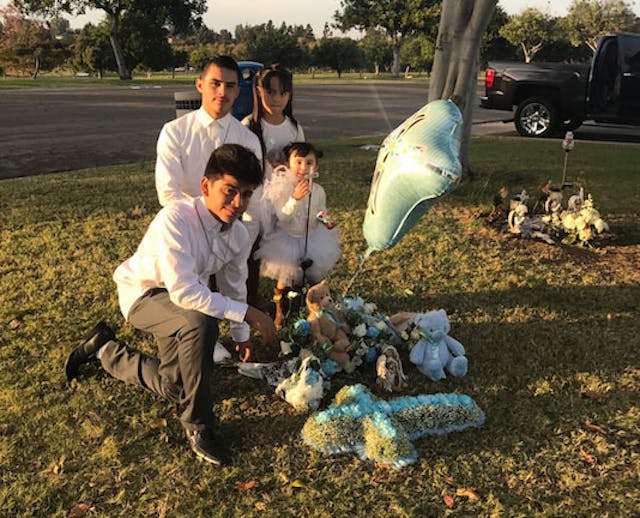 The Zaragosa children gather at their brother Joshua’s memorial (Photo: Claudia Zaragosa) miscarried