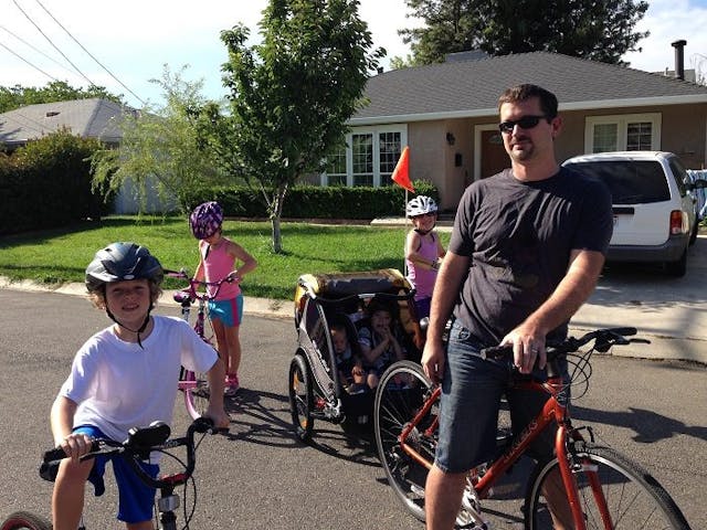 Kyle and his family out for a bike ride. Kyle was born with spina bifida after his parents refused abortion. Photo courtesy of the Wells family chose life