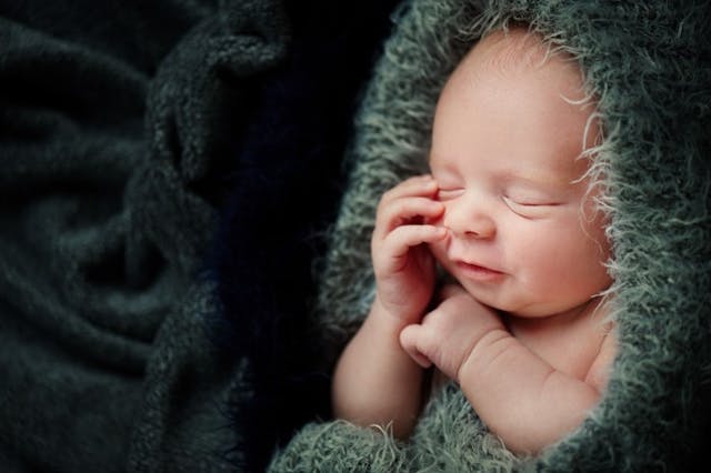green-blanket-baby