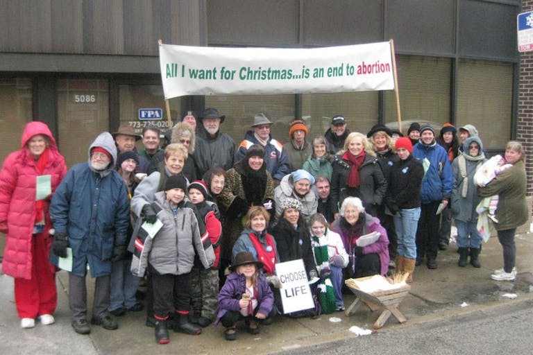 Pro-Life Action League Empty Manger Christmas Caroling Group