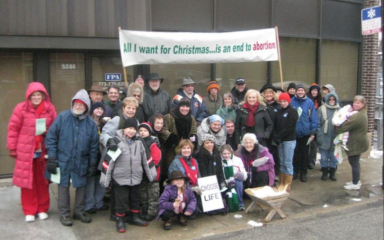 Pro-Life Action League Empty Manger Christmas Caroling Group