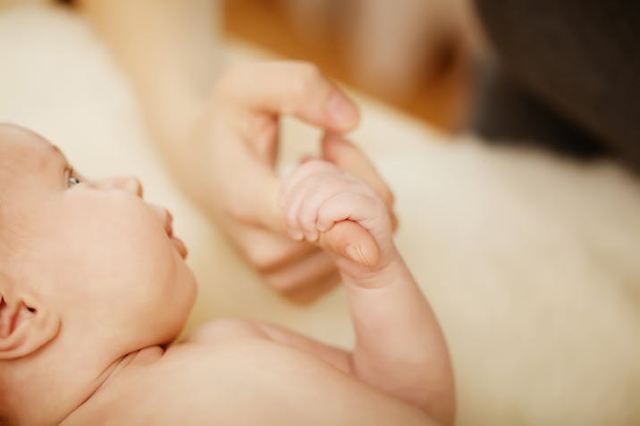 Photo: Shutterstock baby gripping adults's hand