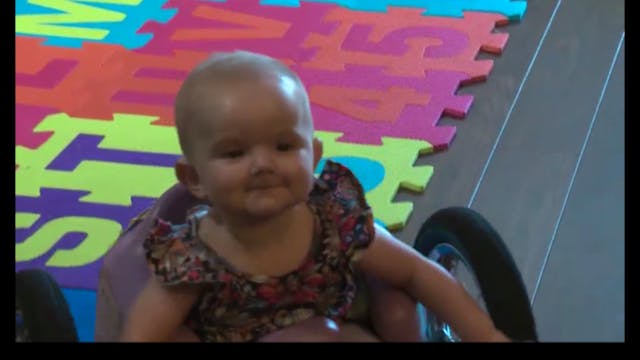 Screenshot from Global News report of Eva cruising in her custom wheelchair.