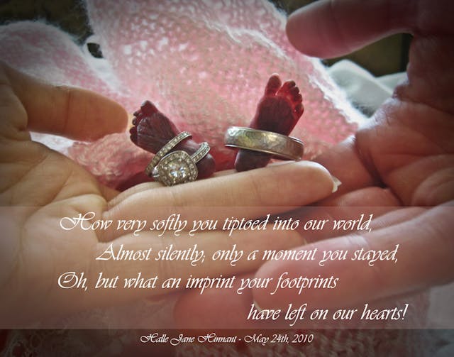 Baby Halle’s feet with her parents’ rings and hands. Baby Halle's feet with her parents' rings and hands.