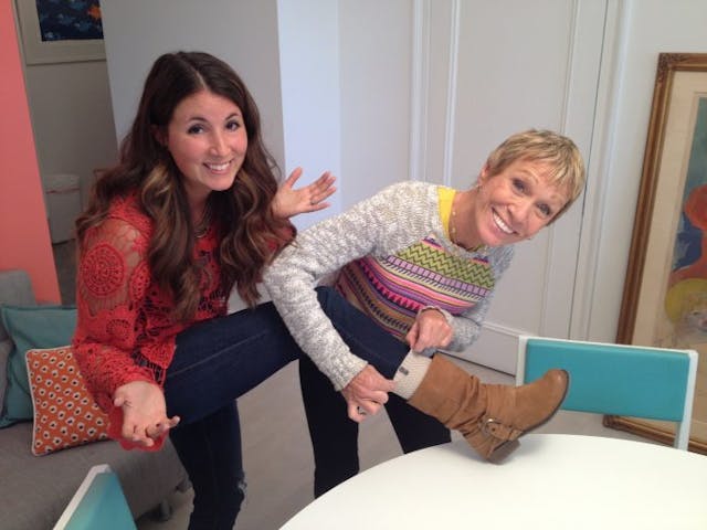 Melissa and Shark Tank investor Barbara Corcoran show off Melissa's popular socks.